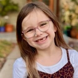 Jake smiling in her glasses